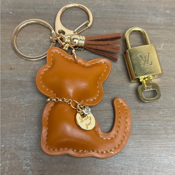 Authentic Louis Vuitton Lock Key Burnt Orange Cat Tassel, Bag Charm,Key Chain - Picture 4 of 9